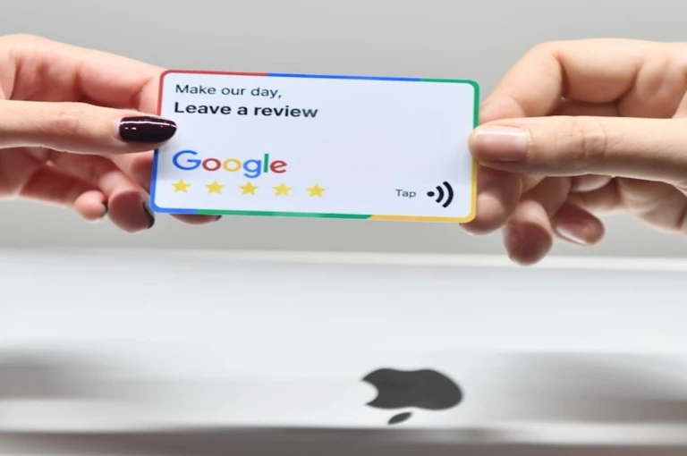 Person holding a Google five-star review NFC tap card — reputation management for Canadian roofing contractors